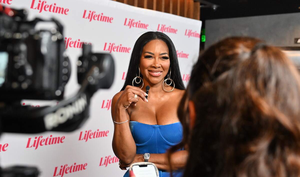 Kenya Moore speaks to the media while walking on the red carpet for her new Lifetime movie "Abducted Off The Street: The Carlesha Gaither Story"