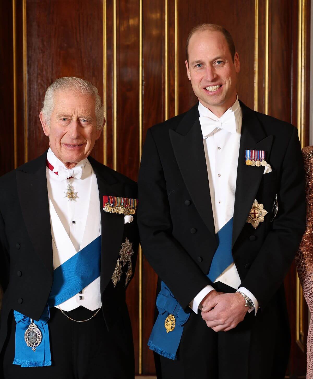 King Charles III and Prince William pose for a photograph ahead of The Diplomatic Reception in the 1844 Room at Buckingham Palace