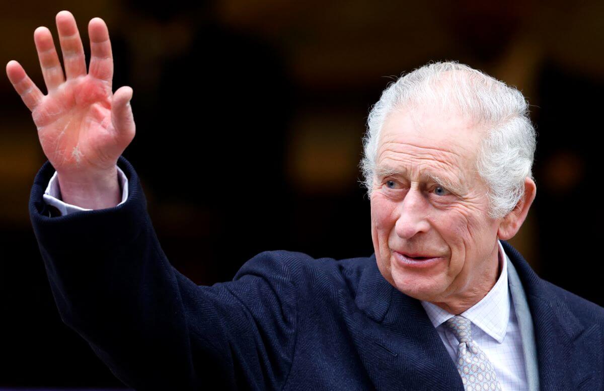 King Charles III waves as he leaves The London Clinic after undergoing a corrective procedure for an enlarged prostate