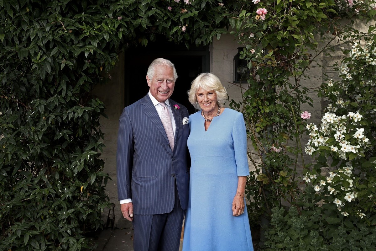 King Charles and Queen Camilla pose for an official portrait at their Welsh residence Llwynywormwood in Myddfai, Wales