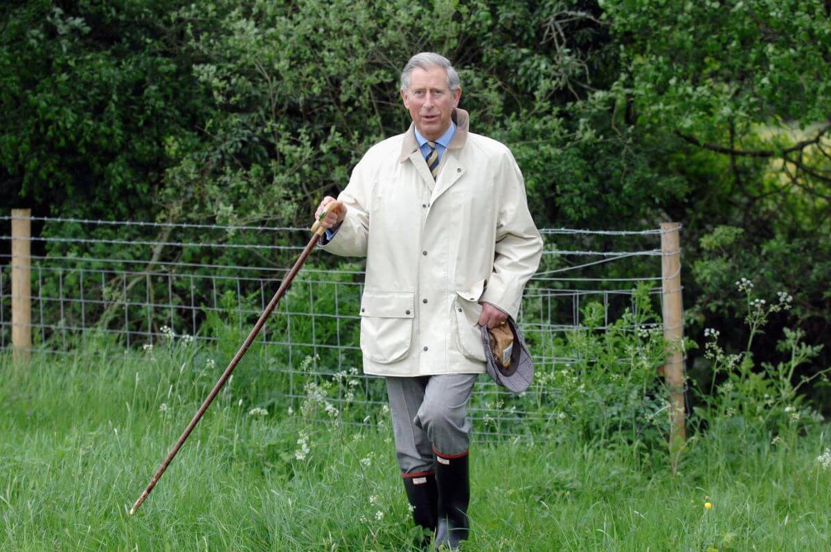 King Charles walks in the country between Clattinger Farm and Lower Moor Farm Nature Reserve in Malmesbury, England