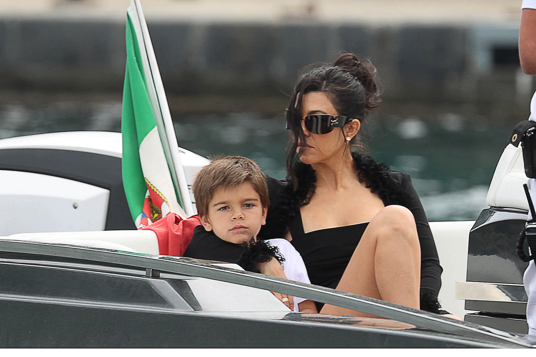 Kourtney Kardashian and her son Reign Disick on a boat in 2022