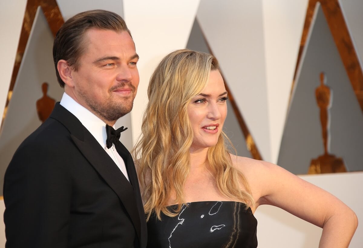 Leonardo DiCaprio posing next to Kate Winslet while they attend the 88th Annual Academy Awards.