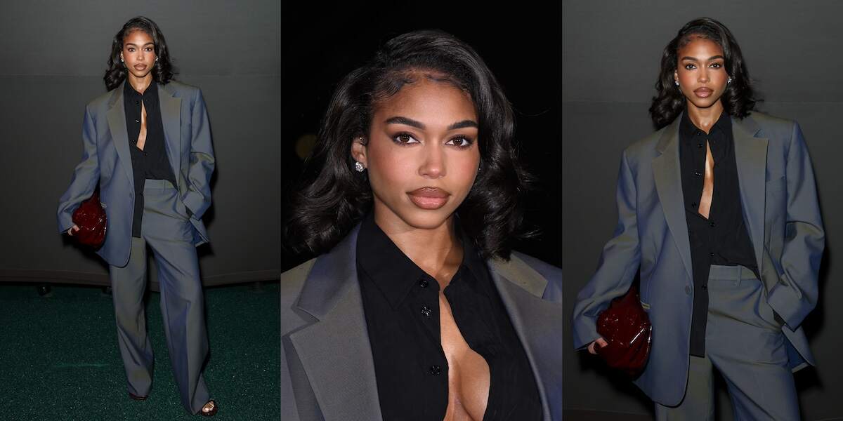 Model Lori Harvey poses at the Burberry fashion show in an oversized gray suit