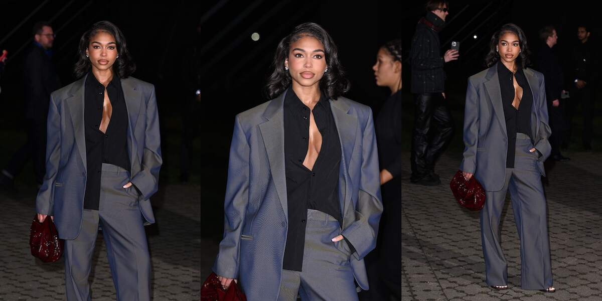 Model Lori Harvey poses at the Burberry fashion show in an oversized gray suit