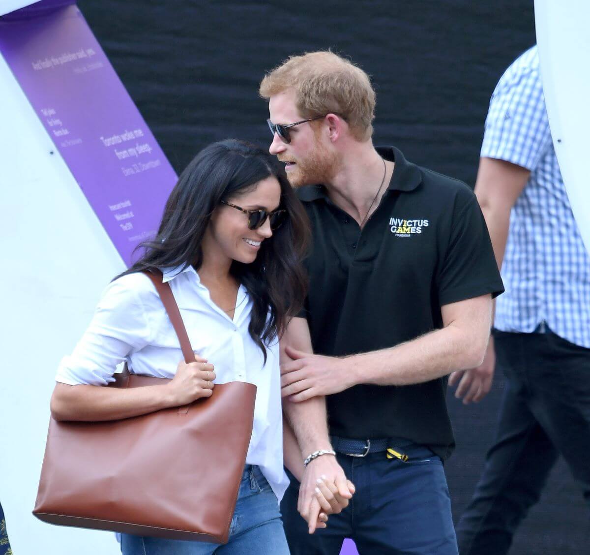 Meghan Markle and Prince Harry hold hands during first public appearance together at the Invictus Games Toronto