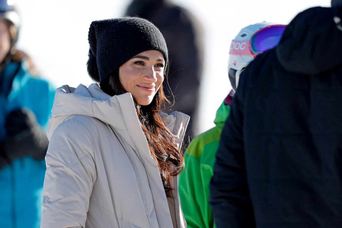 Meghan Markle smiles and looks on in Canada at the 2025 Invictus Games One Year to Go events before later being spotted at an L.A. restaurant