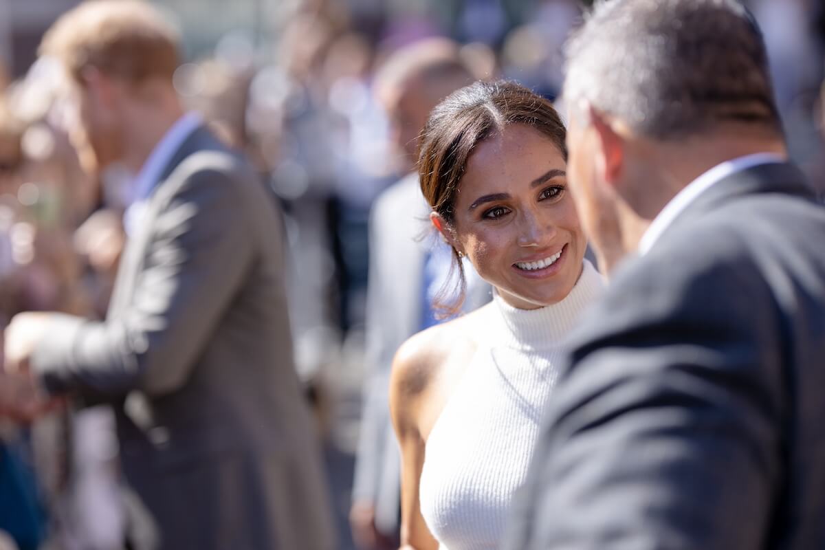 Candid photo of Meghan Markle mid-conversation