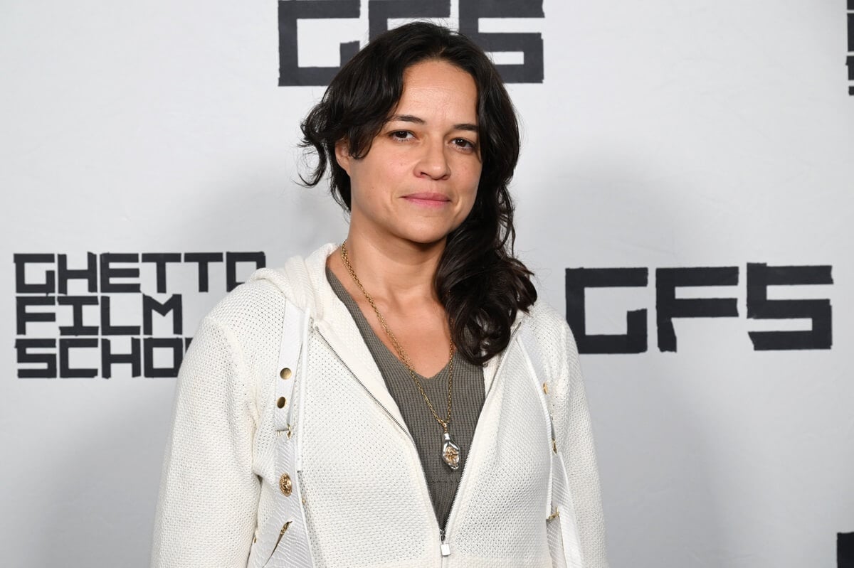 Michelle Rodriguez posing in a white sweater while at the 2023 GFS Fall Benefit.