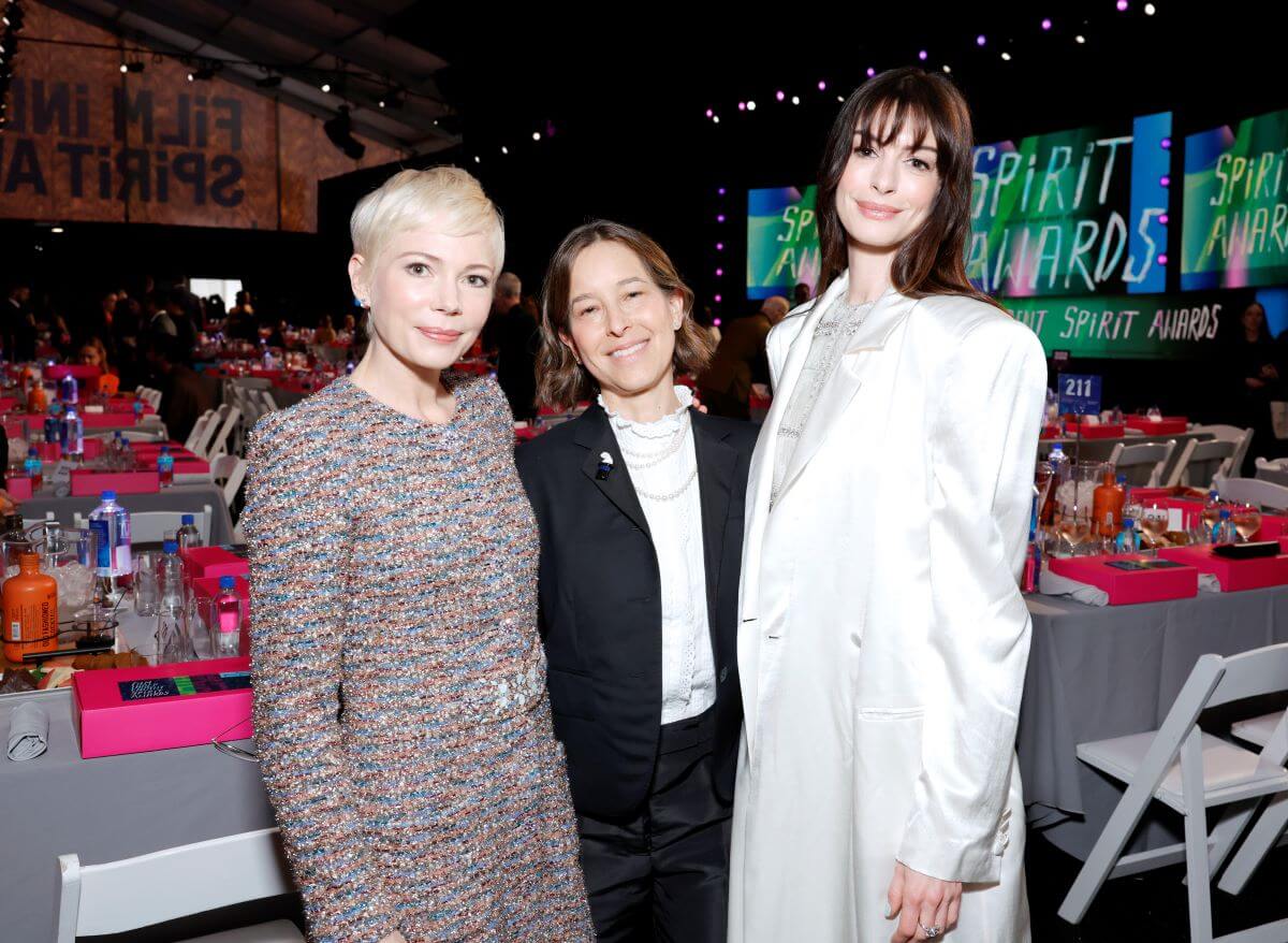 Michelle Williams, Pamela Koffler, and Anne Hathaway stand together at the Independent Spirit Awards.