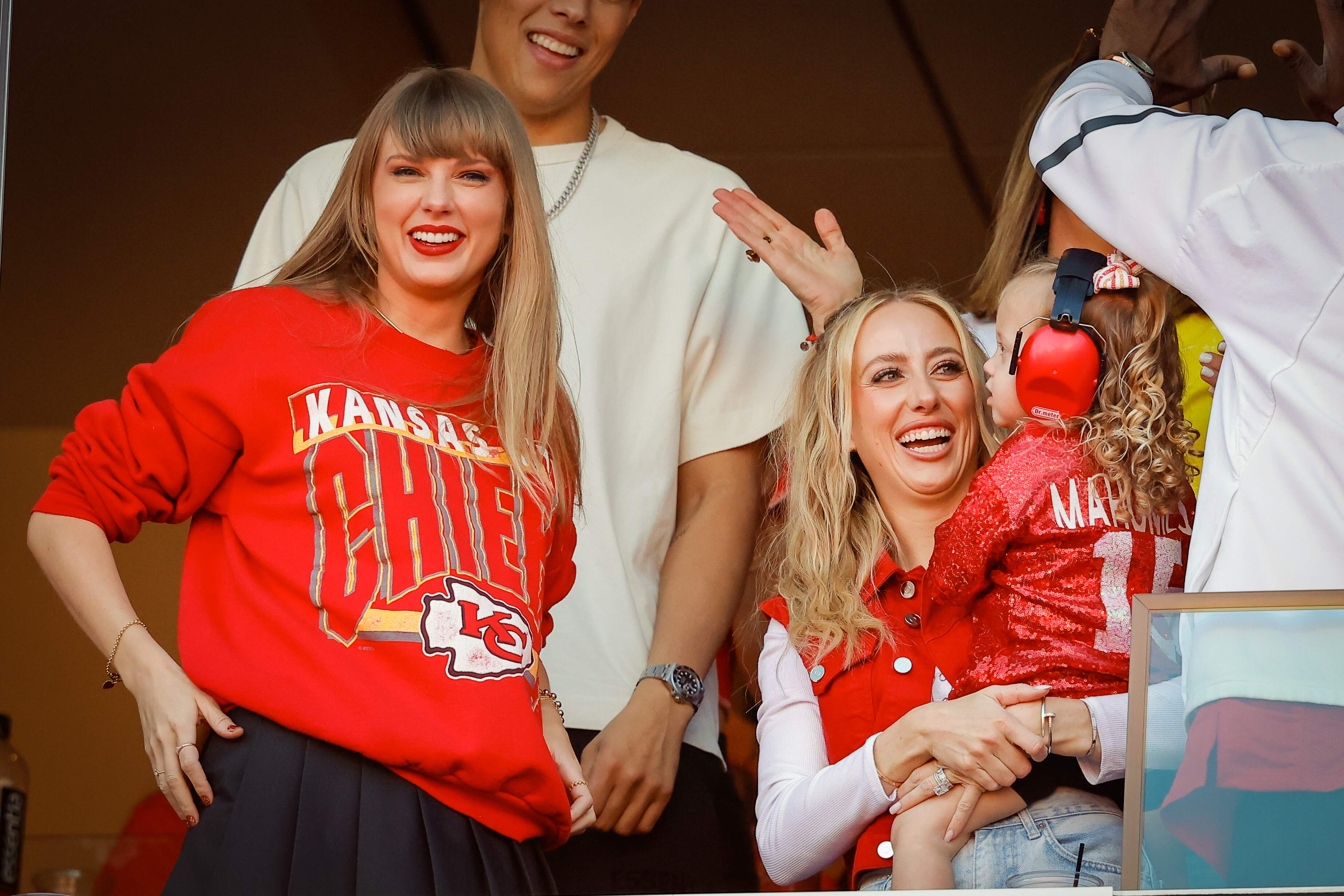 Singer-songwriter Taylor Swift cheers from a suite as the Kansas City Chiefs play