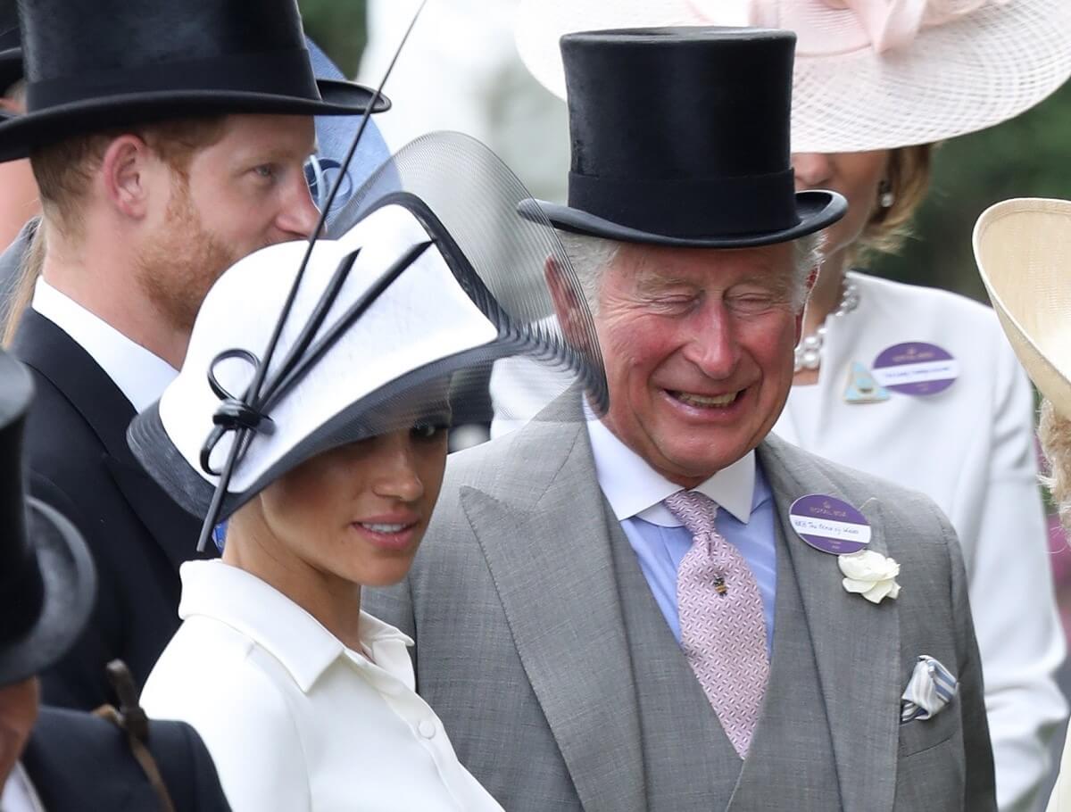 Prince Harry, Meghan Markle, and now-King Charles at Ascot Racecourse together in 2018