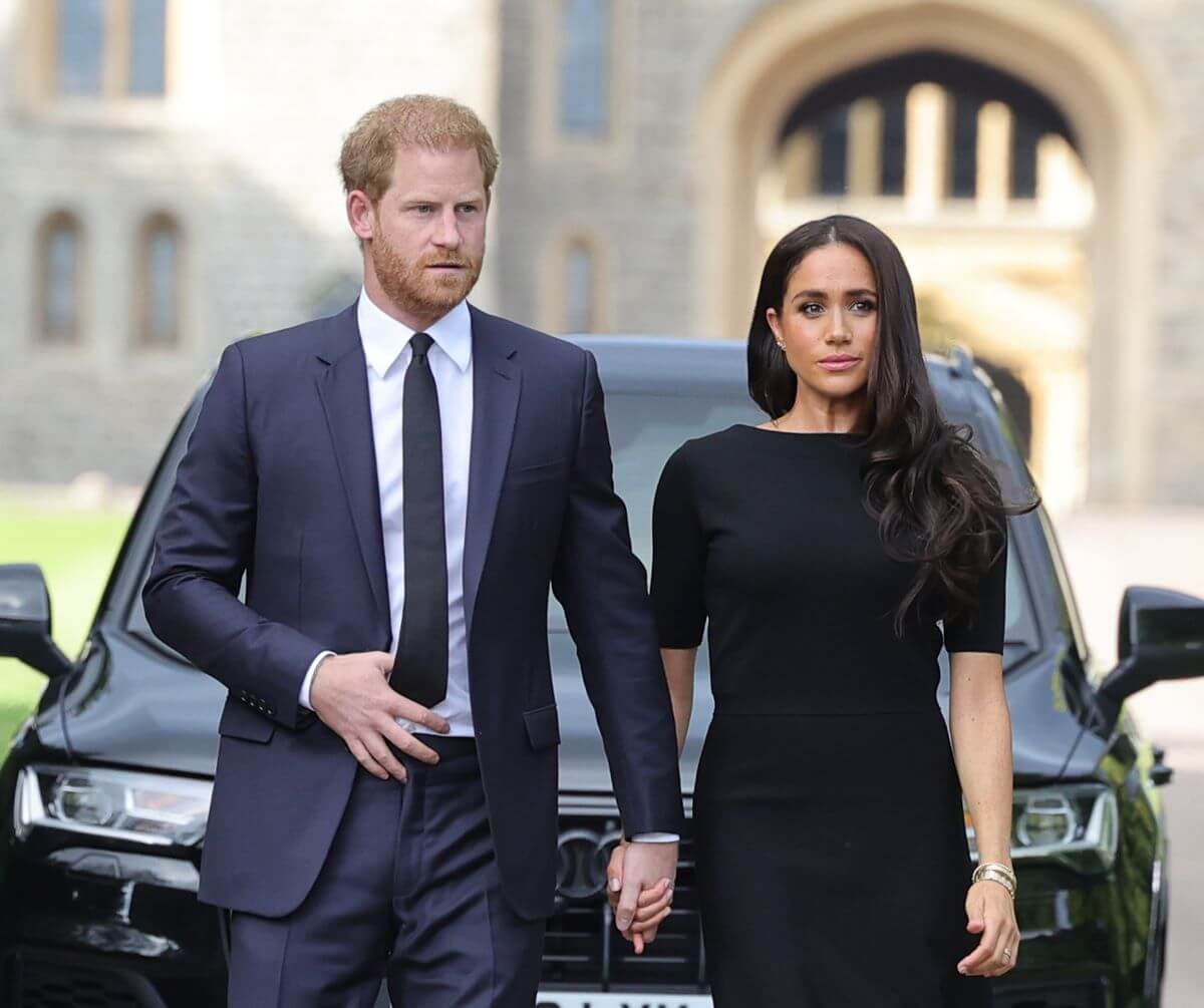 Prince Harry and Meghan Markle arrive on the Long Walk at Windsor Castle to view flowers and tributes to Queen Elizabeth II