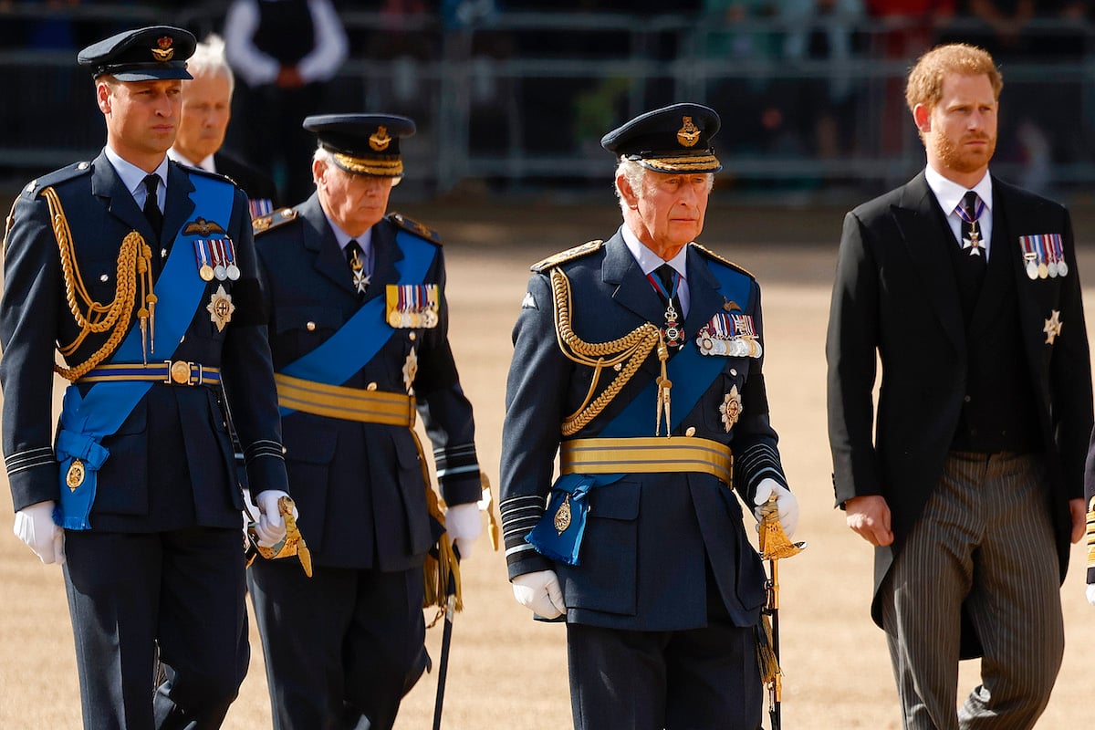 Prince Harry, who may spend years trying to renconcile with his father and brother, walks with Prince William and King Charles III