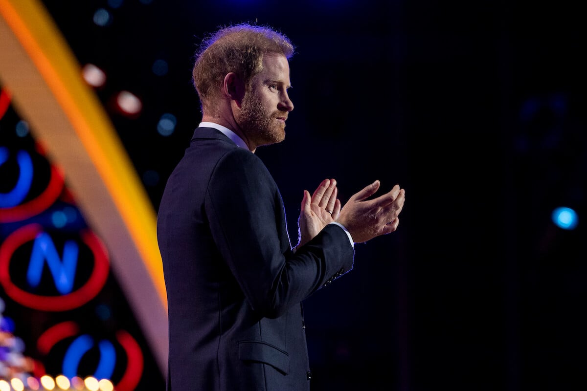 Prince Harry, who wasn't at the Super Bowl, claps onstage at the 2024 NFL Honors