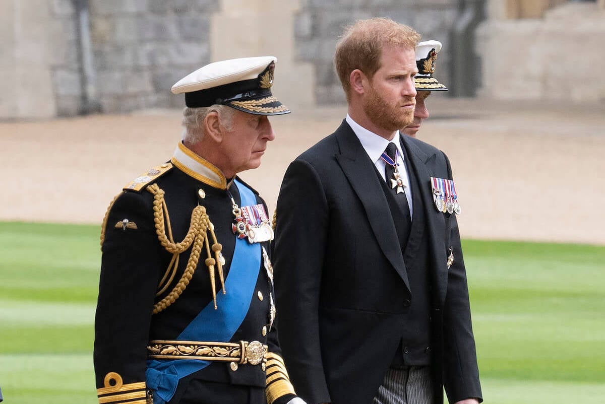 Prince Harry, whose visit to King Charles was reportedly short because of Queen Camilla, walks with King Charles in 2022