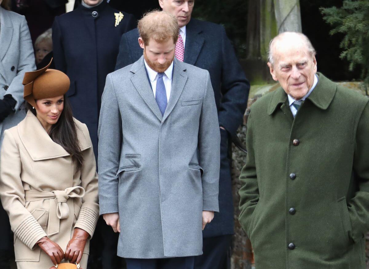 Prince Philip, Meghan Markle, and Prince Harry following Christmas Day Church service at Sandringham