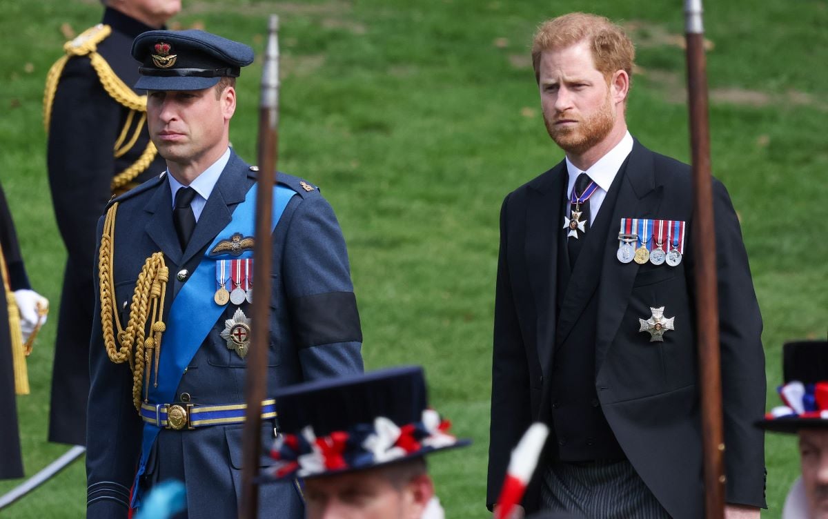 Prince William and Prince Harry look on as the coffin carrying Queen Elizabeth II is transferred to a hearse for its journey to Windsor