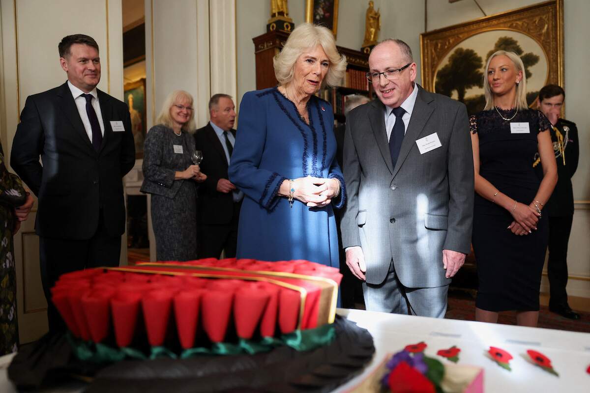 Camilla Parker Bowles talks to Mark Young, a production manager at The Poppy Factory