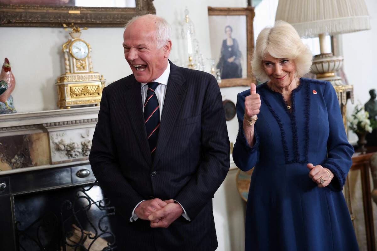 Camilla Parker Bowles gives a thumbs up during a reception at Clarence House