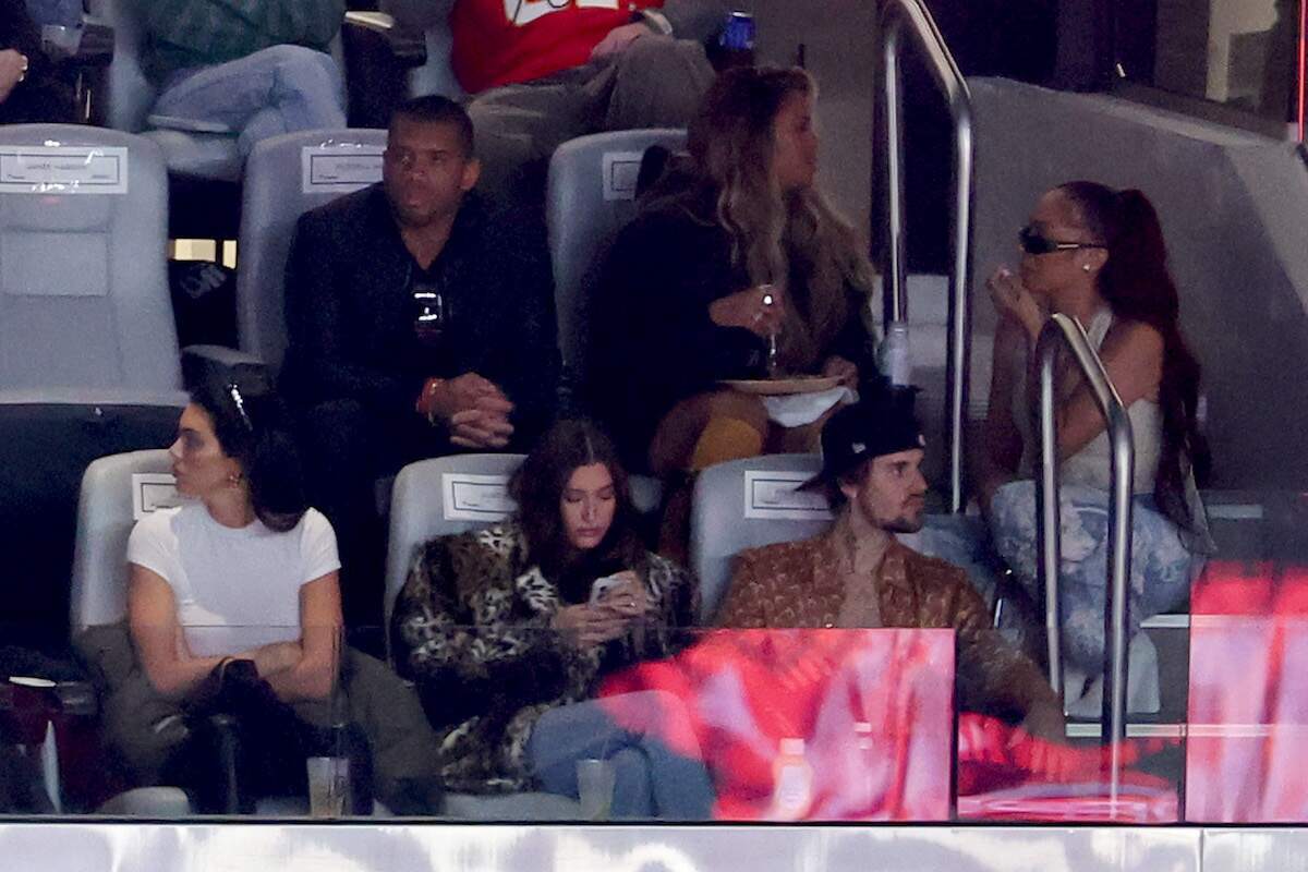 NFL player Russell Wilson and wife Ciara sit behind Kendall Jenner, Hailey Bieber, and Justin Bieber at Super Bowl LVIII