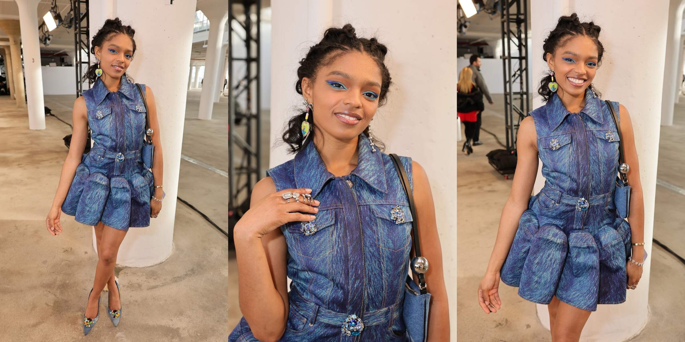Wearing a blue denim dress, Selah Marley poses before the Area fashion show during New York Fashion Week