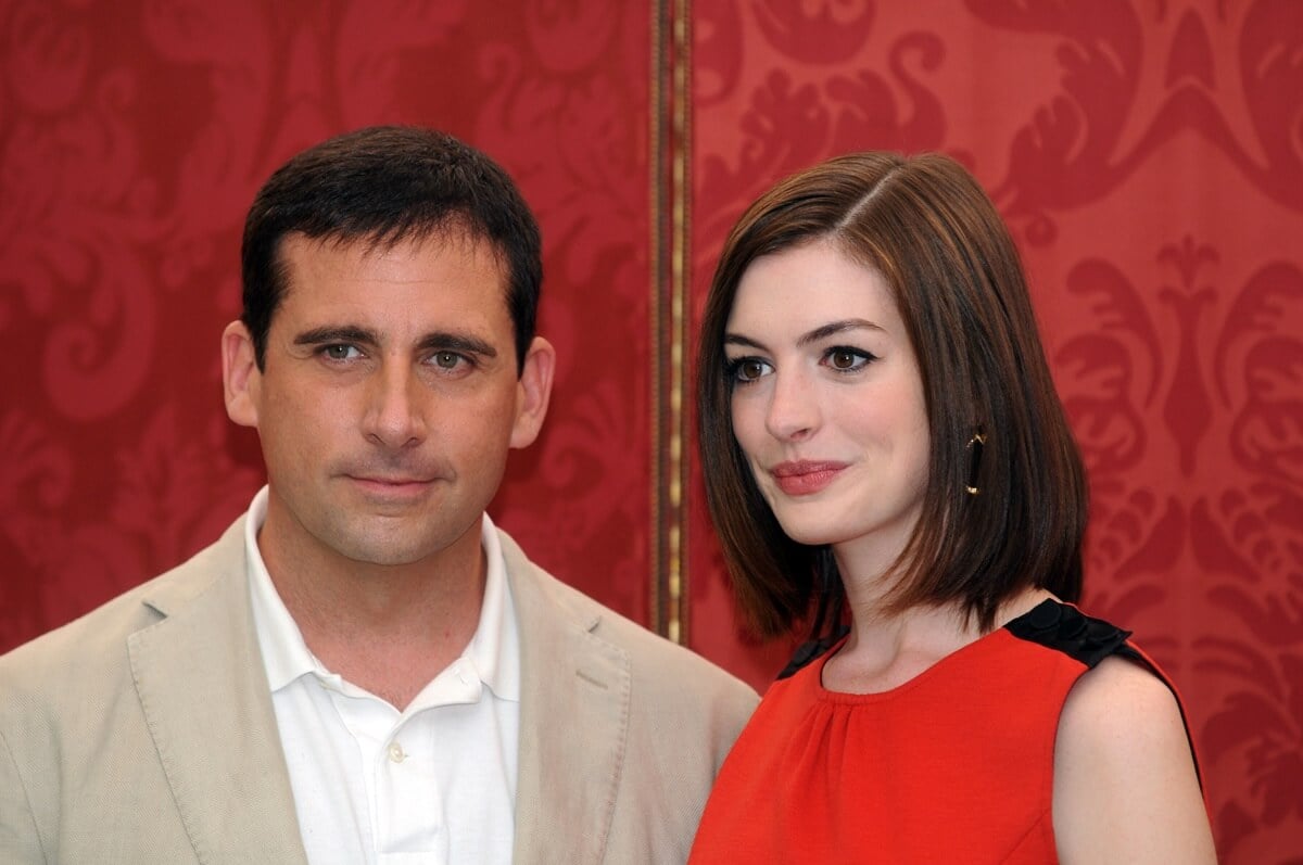 Steve Carell posing next to Anne Hathaway at a photocall for 'Get Smart'.
