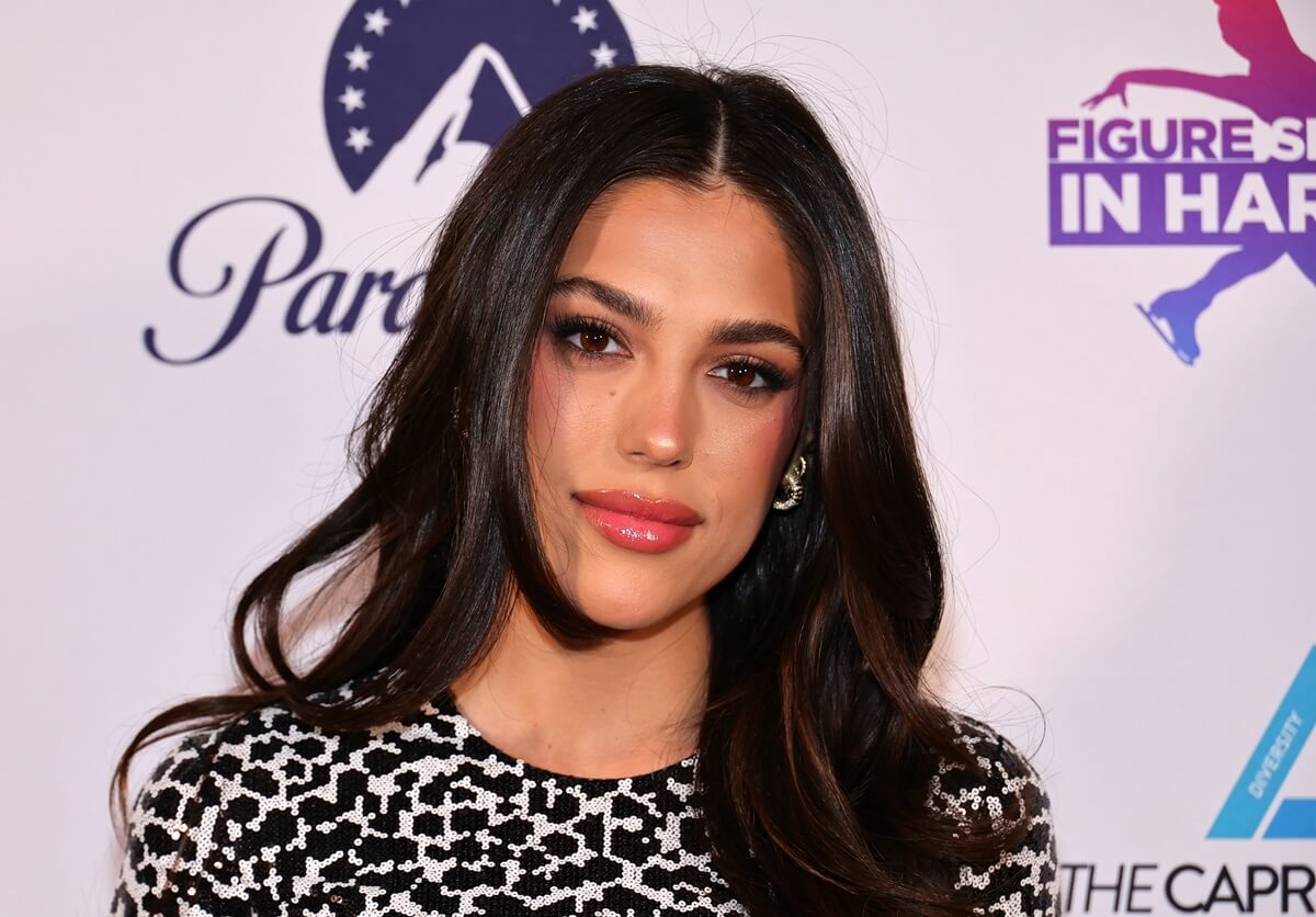 Sylvester Stallone's daughter Sistine Stallone at the 26th Annual Celebrating Excellence & Sisterhood Gala at Gotham Hall, posing in in a black and white dress.