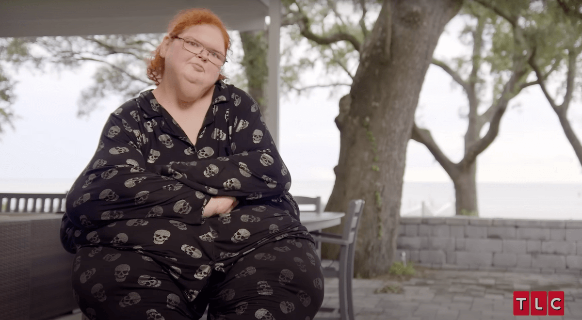 Tammy Slaton sitting in front of trees in an episode of '1000-lb Sisters'