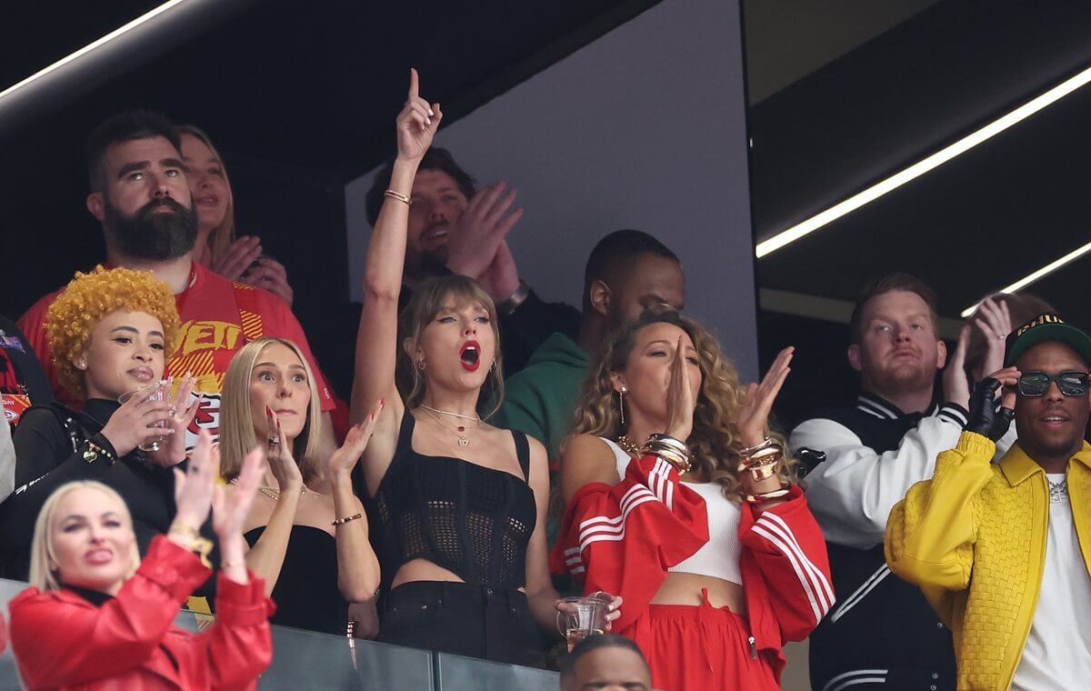 Taylor Swift, Ice Spice, and Blake Lively reacting to a play Super Bowl LVIII between the San Francisco 49ers and Kansas City Chiefs