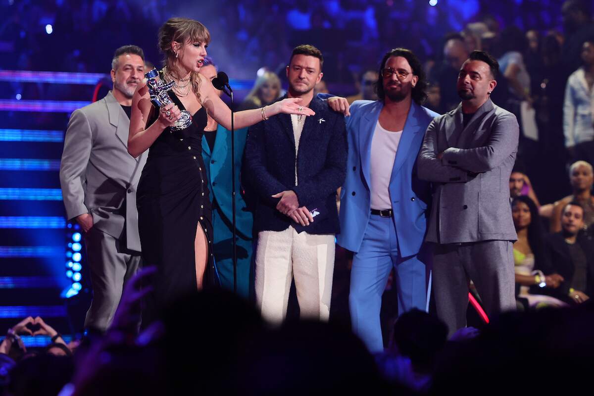 Taylor Swift accepts the Best Pop award for "Anti-Hero" from NSYNC's Joey Fatone, Lance Bass, Justin Timberlake, JC Chasez, and Chris Kirkpatrick at the 2023 MTV Video Music Awards