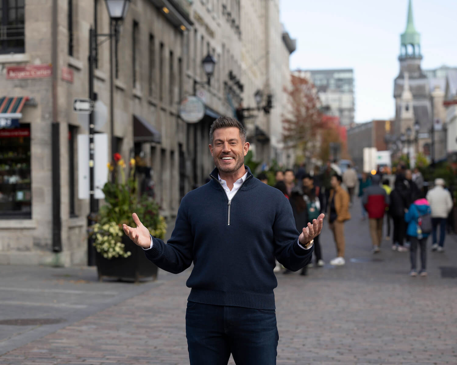 'The Bachelor' Season 28 host Jesse Palmer holding his hands up in Montreal, Canada, in episode 6
