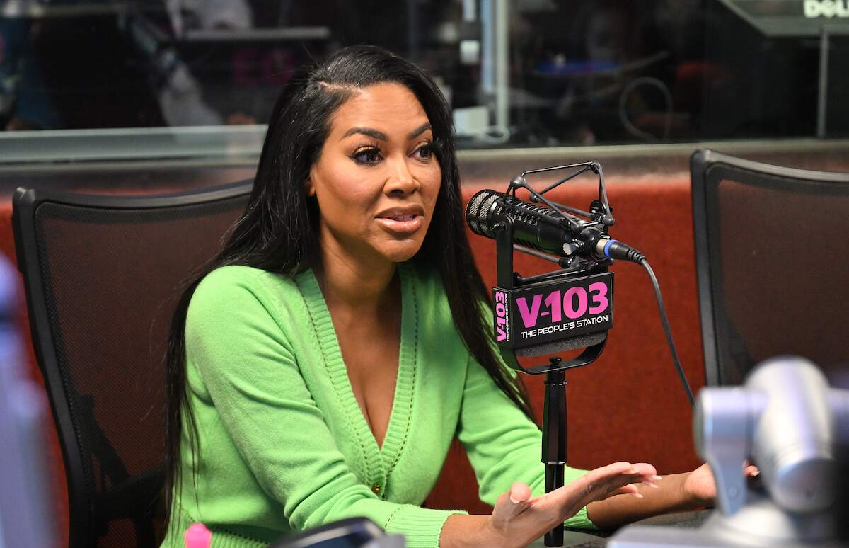 Kenya Moore speaks on an Atlanta radio show on on February 01, 2024 while wearing a bright green cardigan