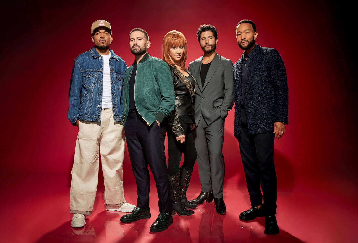 'The Voice' Season 25 coaches Chance the Rapper, Shay Mooney, Reba McEntire, Dan Smyers, and John Legend standing together against a red background