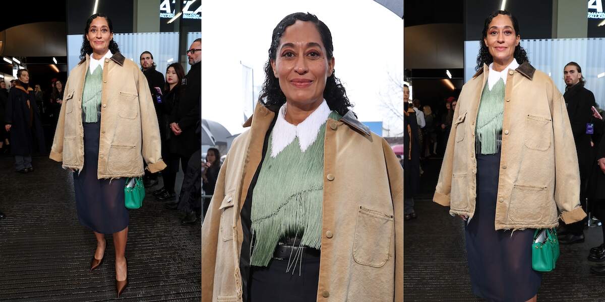 Actor Tracee Ellis Ross wears a workwear-inspired tan jacket and navy skirt at the Prada fashion show