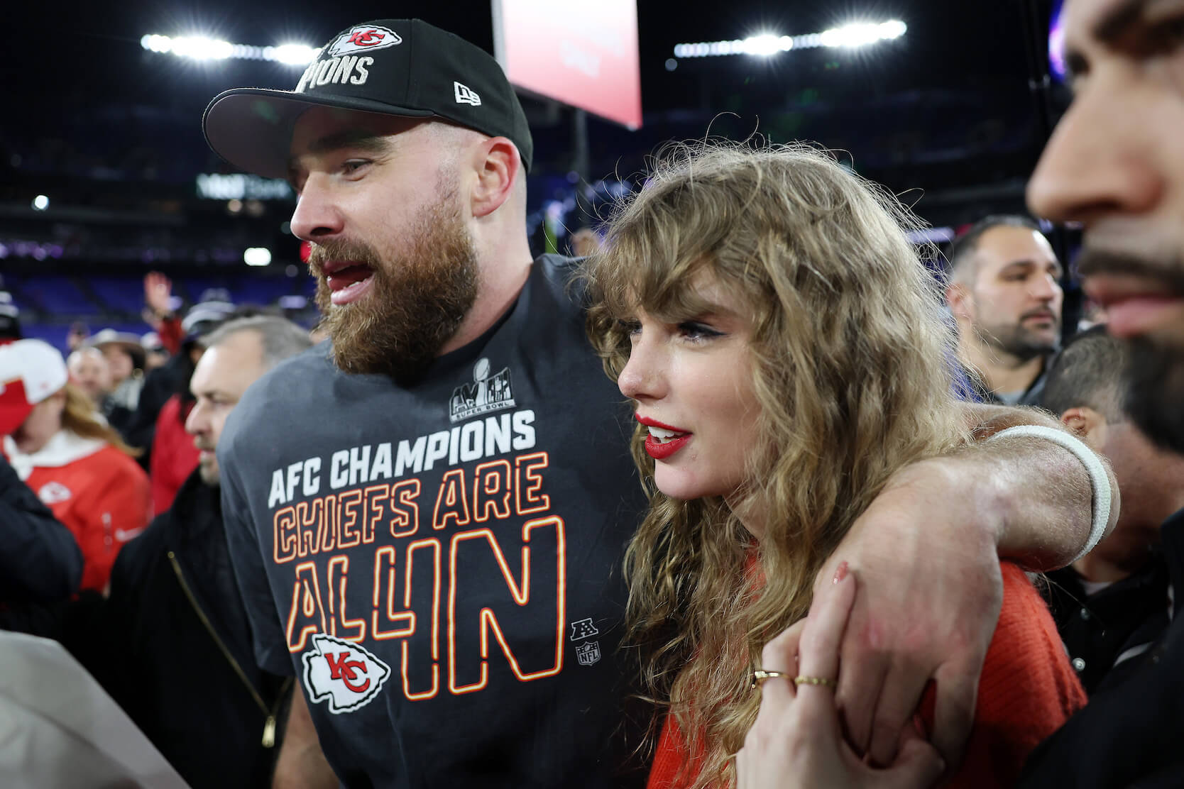 Travis Kelce with his arm around Taylor Swift after a Kansas City Chiefs game