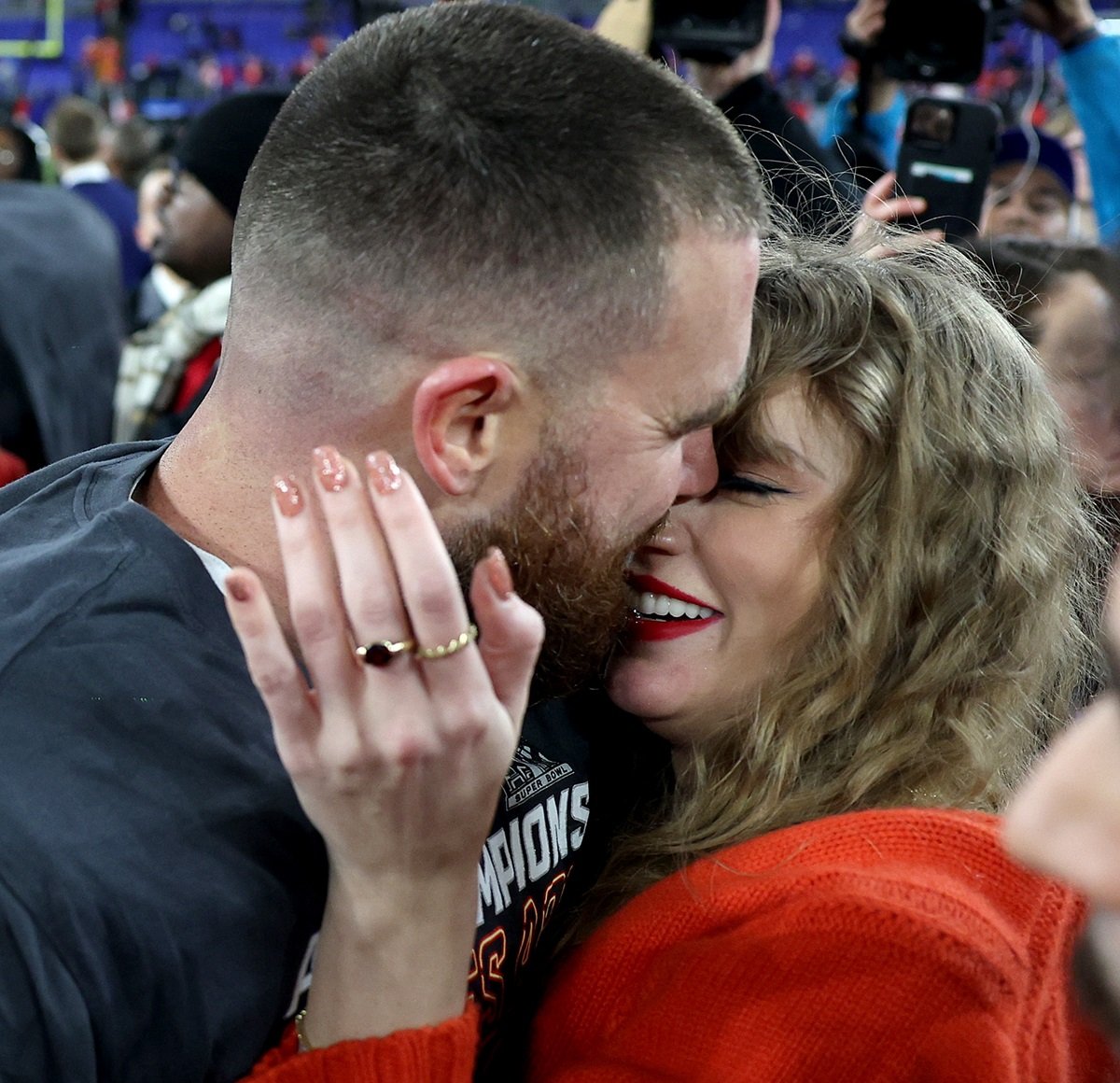 Travis Kelce #87 of the Kansas City Chiefs celebrates with Taylor Swift after a 17-10 victory against the Baltimore Ravens in the AFC Championship Game at M&T Bank Stadium on January 28, 2024 in Baltimore, Maryland.