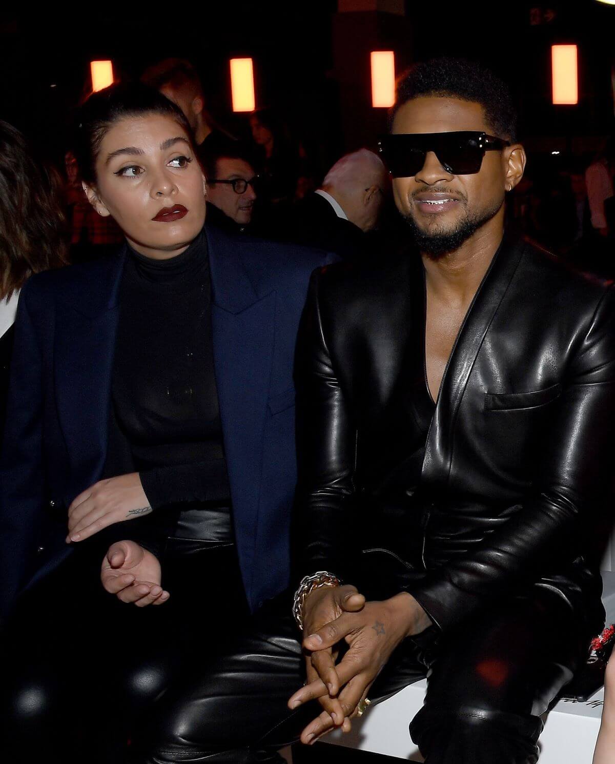 Usher and his girlfriend Jenn Goicoechea attend the Balmain show during Paris Fashion Week