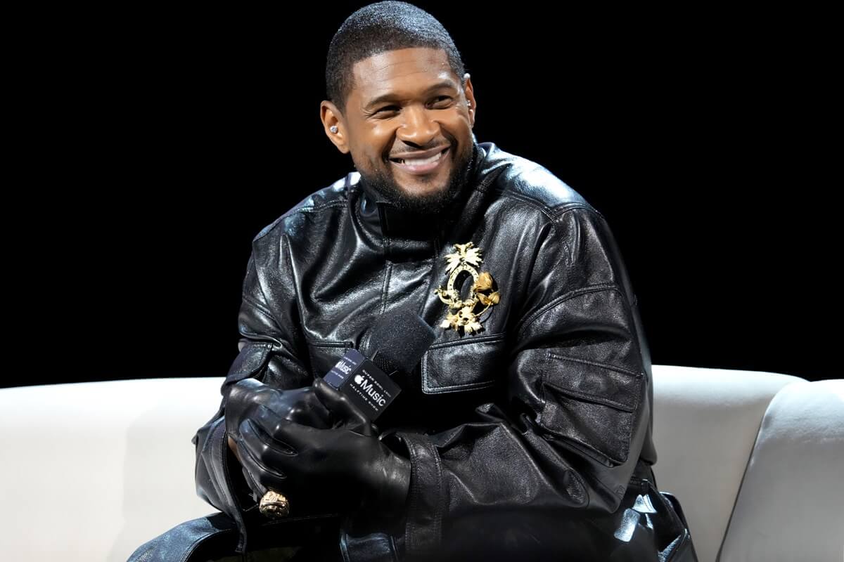 Usher speaks onstage during the Super Bowl LVIII Pregame & Apple Music Super Bowl LVIII Halftime Show Press Conference