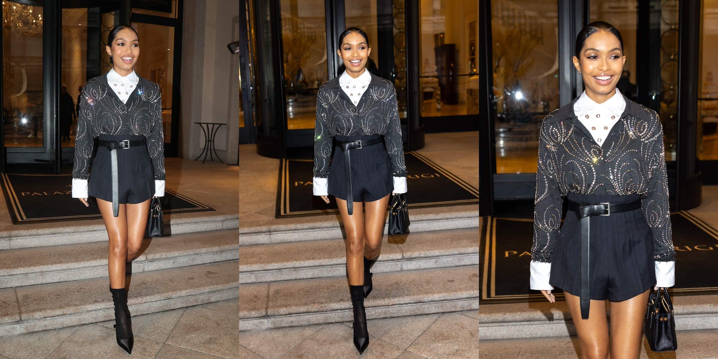 Actor Yara Shahidi walks to the Prada fashion show wearing black shorts and a black top