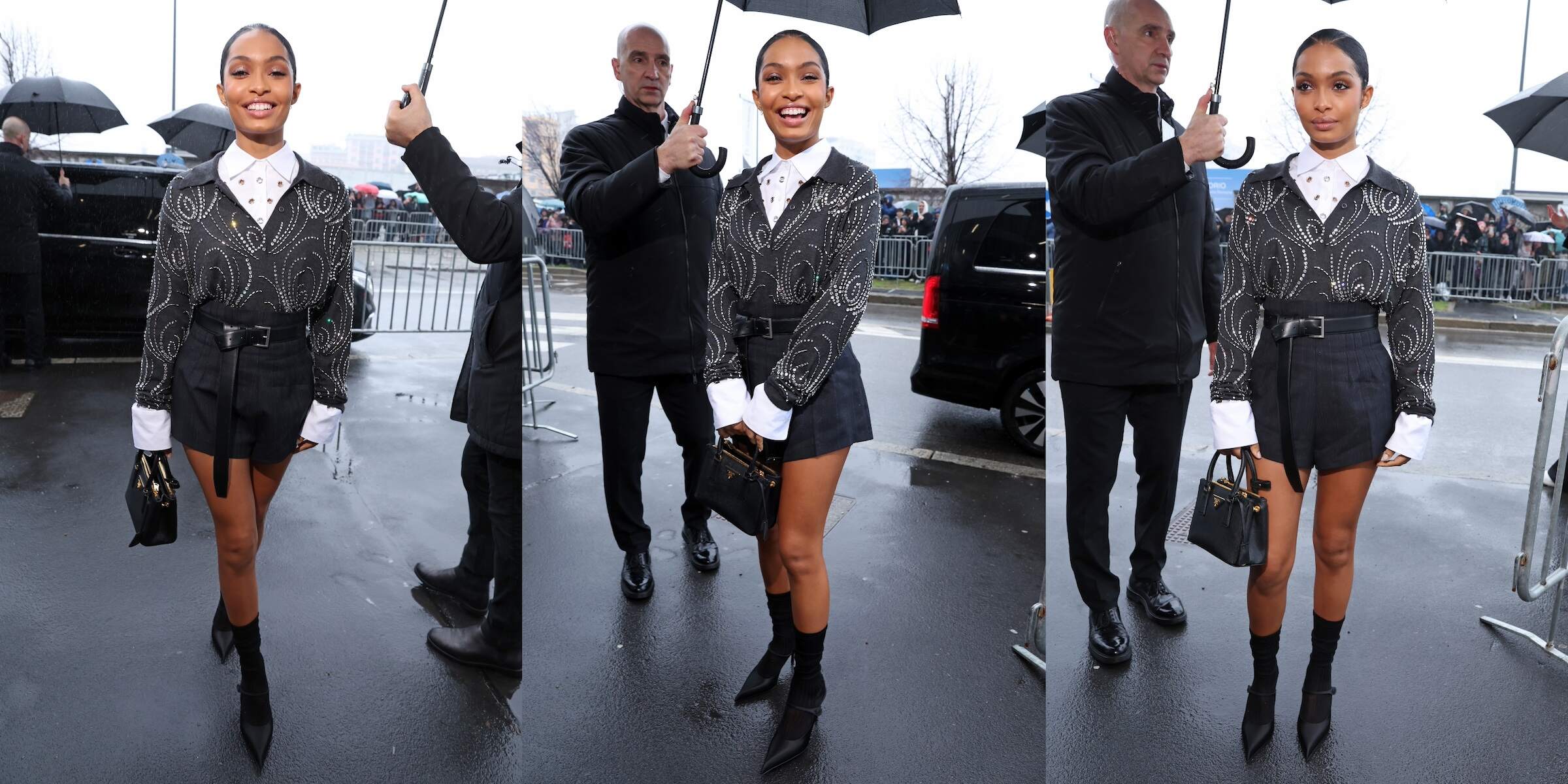 Actor Yara Shahidi at the Prada fashion show wearing black shorts and a black top