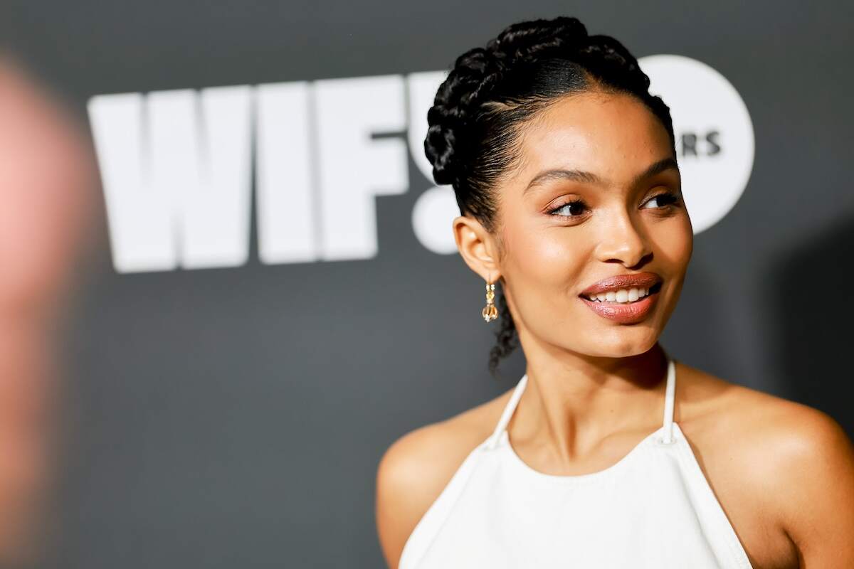 Actor Yara Shahidi wears a white gown on the red carpet