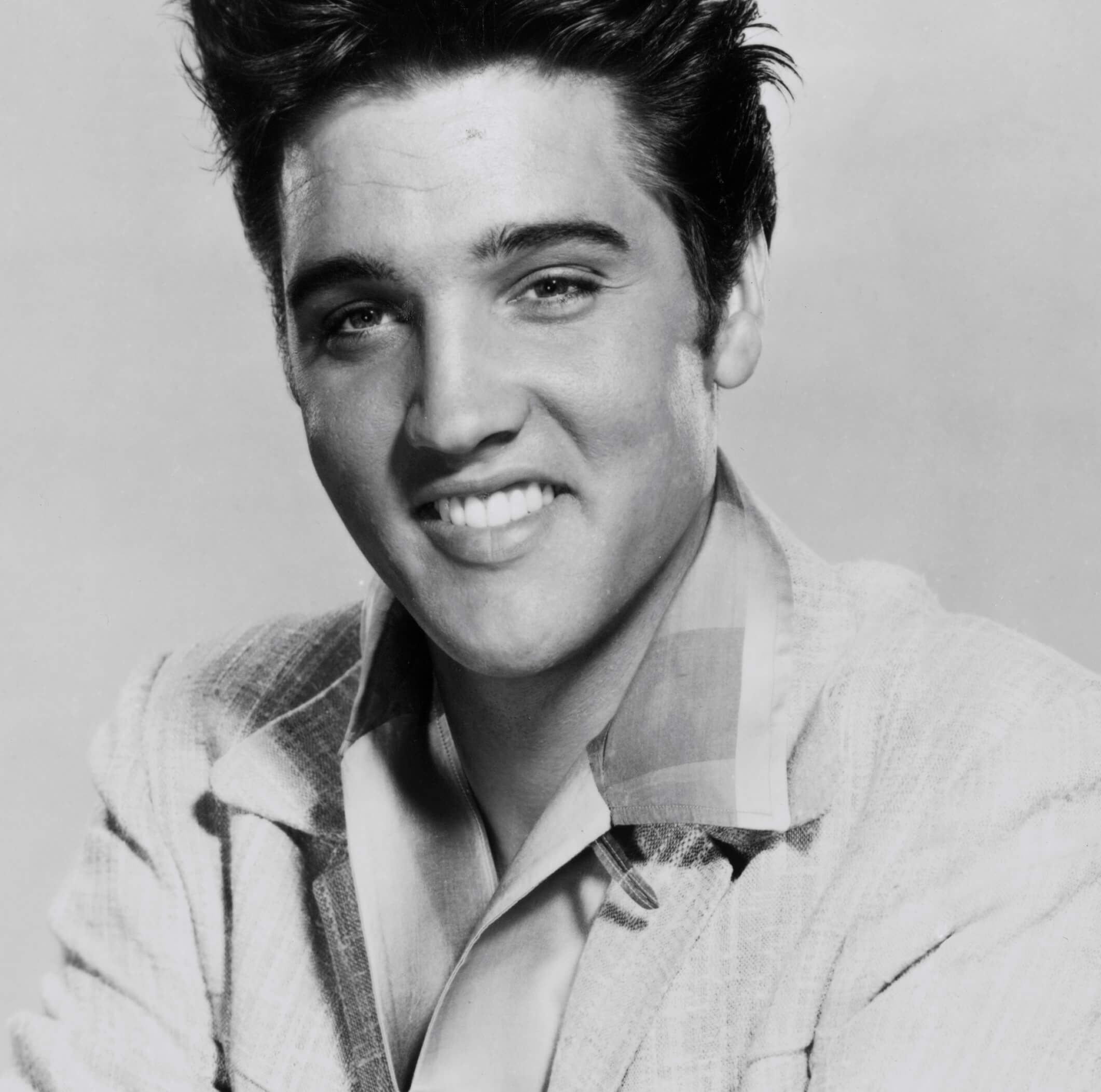 "Bossa Nova Baby" singer Elvis Presley in black-and-white