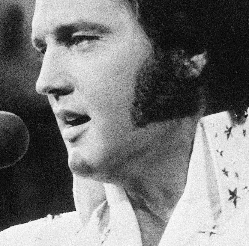 "If I Can Dream" singer Elvis Presley with a white collar