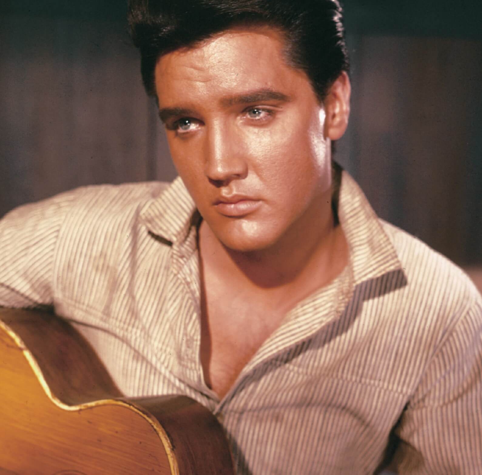 "Rock-A-Hula Baby" singer Elvis Presley looking sad