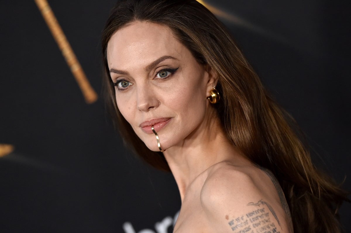 Angelina Jolie posing in a dress at the 'Eternals' premiere.