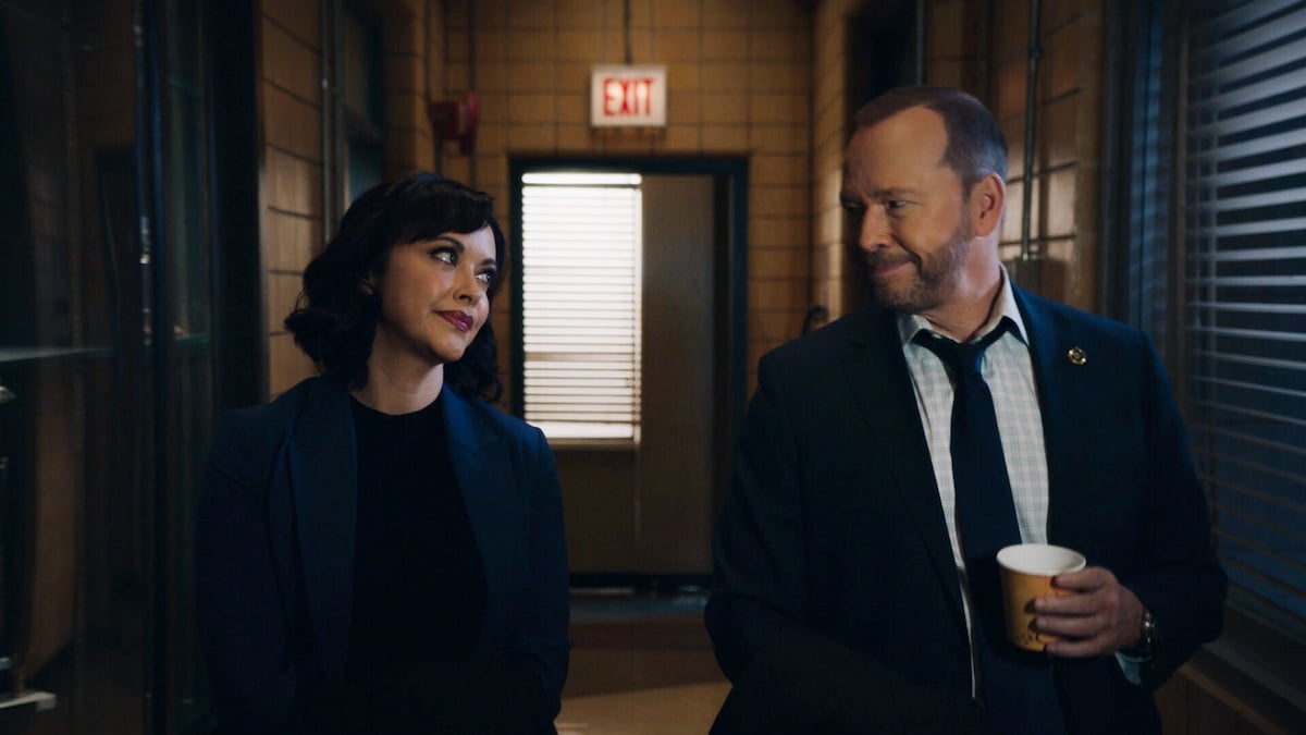 Maria Baez and Danny Reagan smiling at each other in 'Blue Bloods'