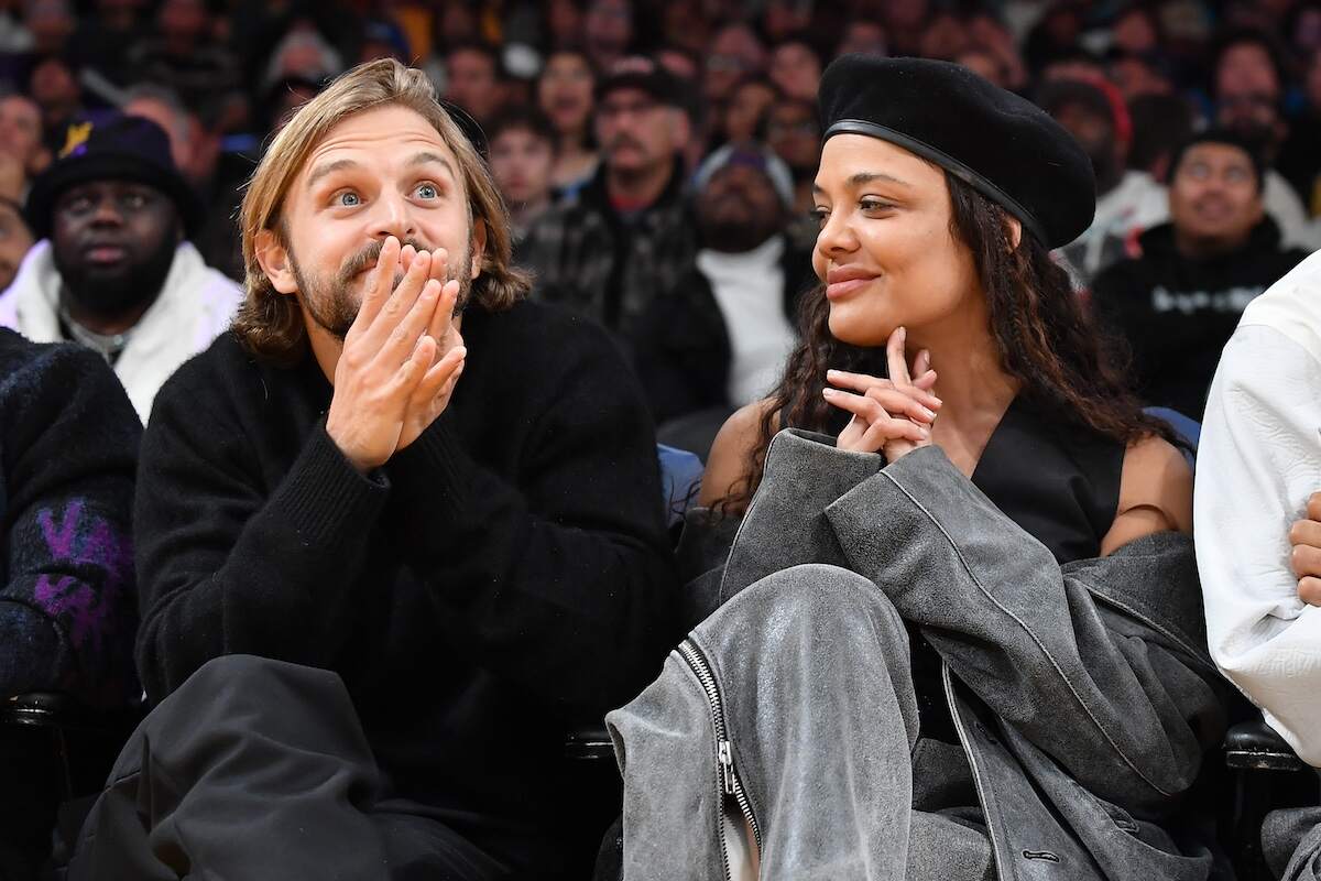 Actor Tessa Thompson and socialite Brandon Green sit together at a Lakers game