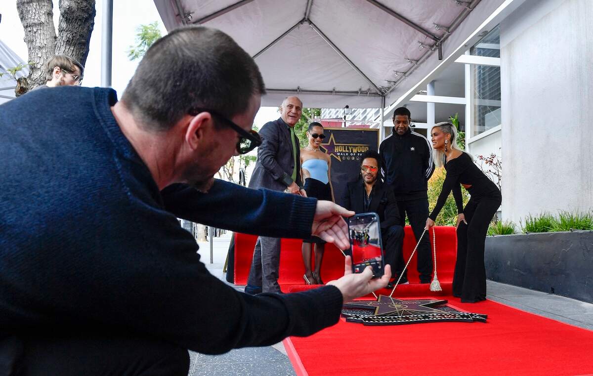 Actor Channing Tatum takes a photo of Steve Nissen, Zoë Kravitz, Lenny Kravitz, Denzel Washington, and Sibley Scoles unveiling Lenny Kravitz's star