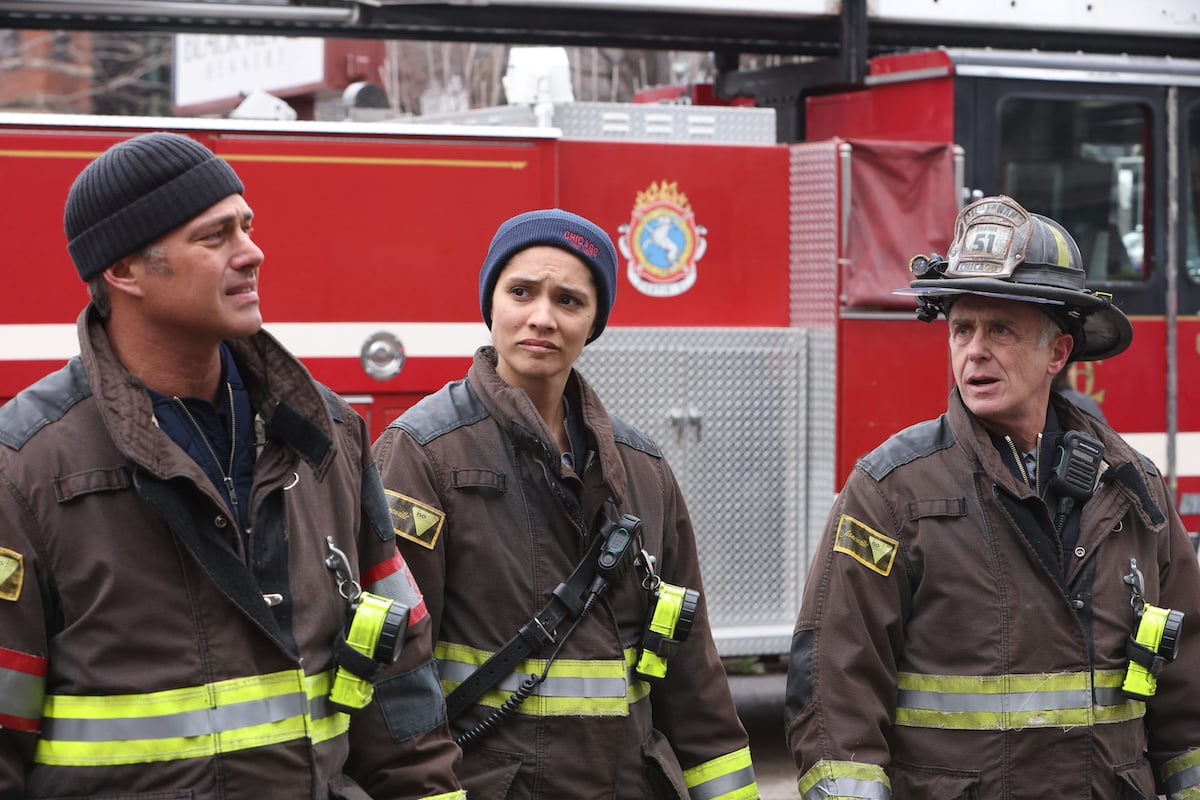 Three firefighters standing in front of a truck on 'Chicago Fire'